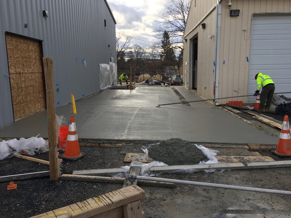 Concrete driveway between bldg