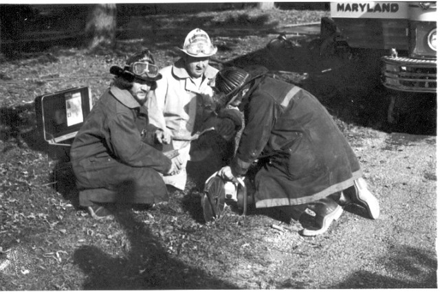 L-R: Jack Stone, Asst. Chief Ed Stagner and unknown starting Stihl saw.