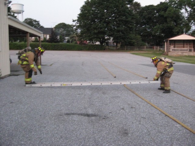 07-17-2008.  Demonstrating basic firefighter skills to the Juniors.  Two man ladder flat raise.