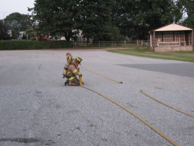 07-17-2008.  Demonstrating basic firefighter skills to the Juniors.  Connecting hose sections.