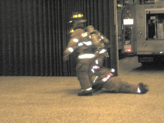 07-17-2008.  Demonstrating basic firefighter skills to the Juniors.  Two man rescue drag.
