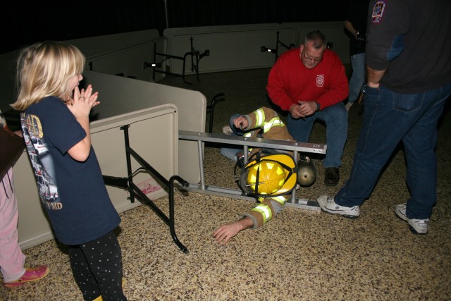 Search & Rescue Training, 2008.  Trying to perfect the technique for passing through a confined access point with full turnout gear and breathing apparatus.