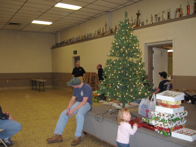 Setting up for Breakfast with Santa, 2007.  Is she the world's youngest Junior Firefighter?