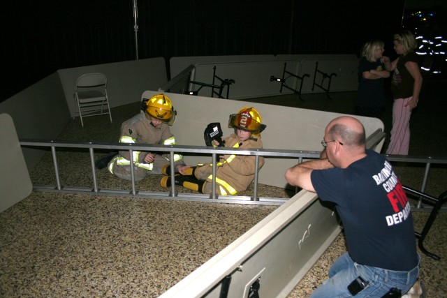 Search and Rescue, 2008.  Searching for a victim under the watchful eyes of the instructor.