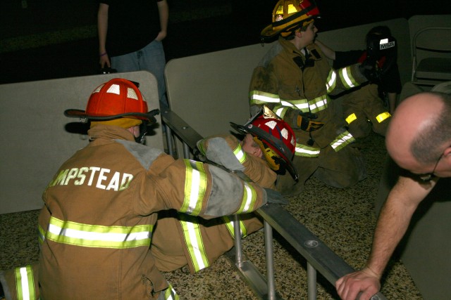 Search and Rescue, 2008.  The Juniors' Captain crawls through the simulated confined access point.