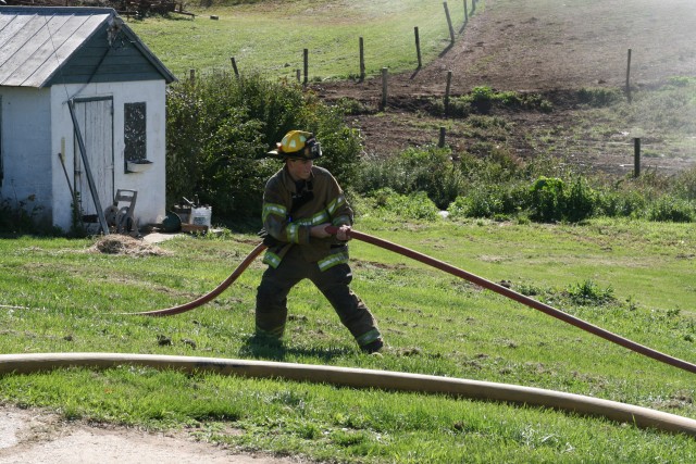 Westminster House Burn Training, 10-19-2008.  Pulling the hose from the burning building.