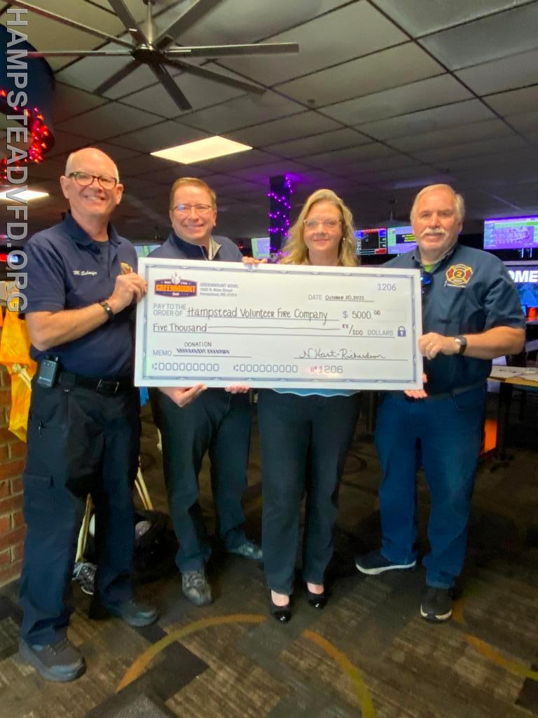 Greenmount Bowl owners Nicole and David Richardson presenting HVFC President James Dwyer and Capital Campaign Chairman Mark Schaefer with a donation to our capital campaign. 